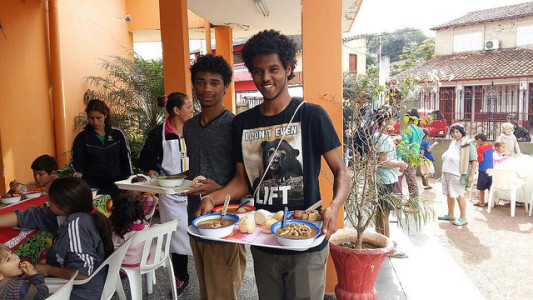 Meron and Darel serving food